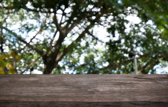 Wood Table Top in Blur Background room interior with empty copy space. photo
