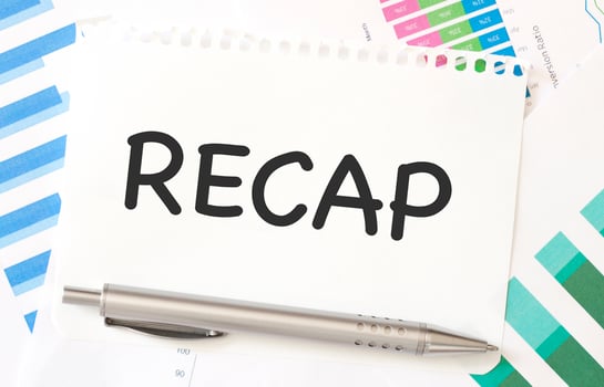 RECAP on white paper with colourful charts photo