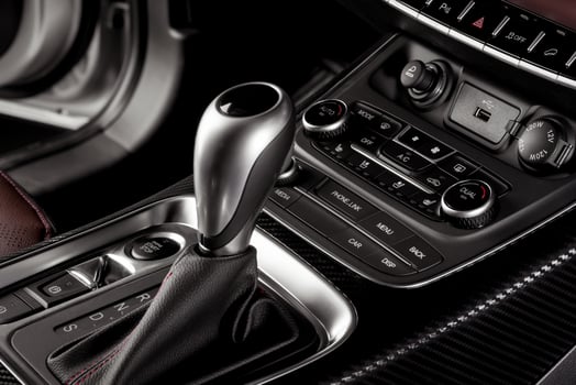 Electronic Gear Shift close up inside a new car with start stop button and electronic hand brake photo