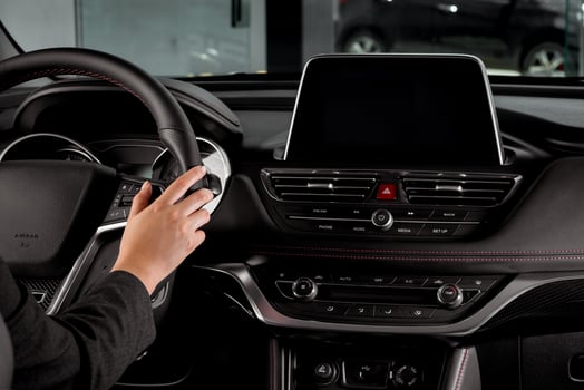 Back view of Businesswoman driving luxury modern car in the city, interior vehicle photo