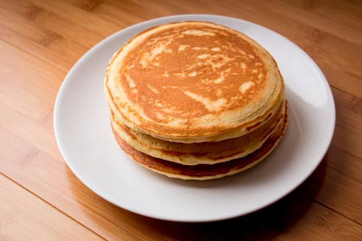 Fluffy Pancakes, wooden background photo