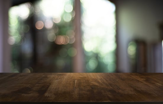 Wood Table Top in Blur Background room interior with empty copy space. photo