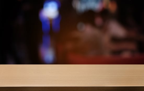 Empty dark wooden table in front of abstract blurred bokeh background of restaurant . can be used for display or montage your products.Mock up for space. photo