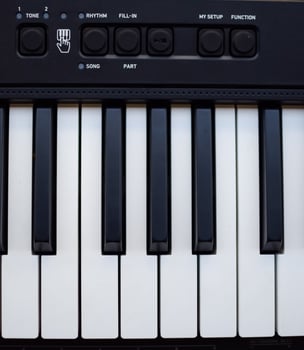Close-up of piano keys. Piano black and white keys and Piano keyboard musical instrument placed at the home balcony during sunny day. photo