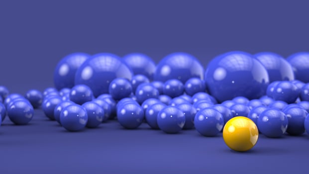 Bright yellow ball stands out on blue background filled with blue spheres - background template photo