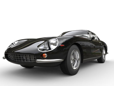 Black classic sports car - headlight closeup shot - isolated on white background photo