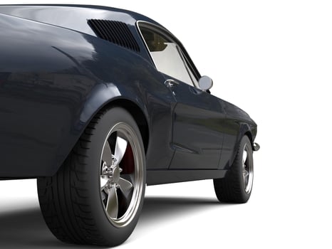 Deep dark blue American vintage muscle car - rear wheel closeup shot photo