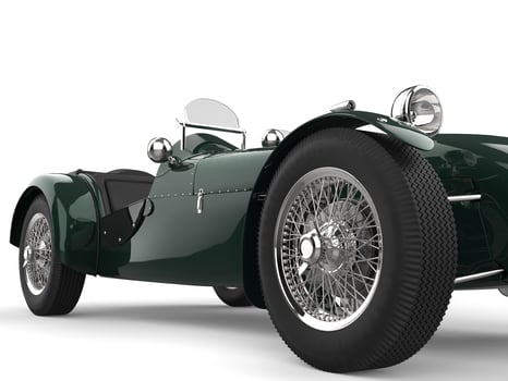 Deep green vintage open wheel sports racing car - low angle closeup shot photo