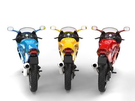 Red, yellow and blue modern super sports bikes - back view photo