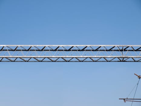 Metal girders - blue sky background photo