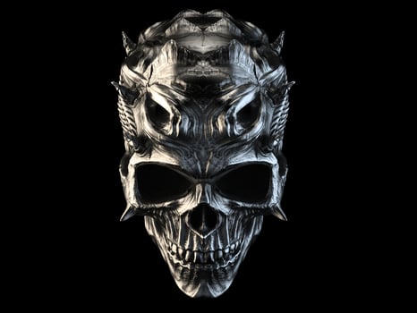 Old silver demon skull with horns and scales photo