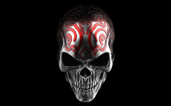 Dark metal skull with intricate red details on top of it photo
