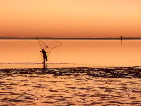 Fisherman at sunset, Karumba Australia photo