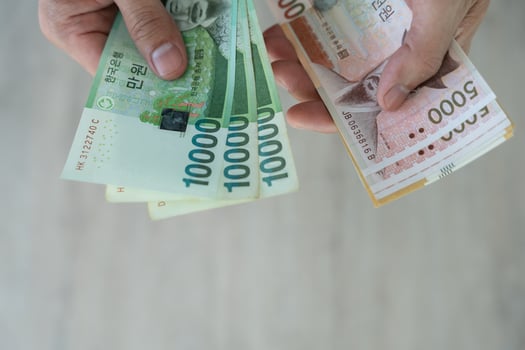The currency of Korea which is used to represent value in exchange and the won is the main currency of Korean people. Korean won notes for money concept background. photo