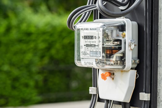 Electric measuring power meter for energy cost at home and office. photo