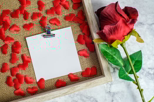 Valentines day background. Red rose with message card of Love romantic couple. photo