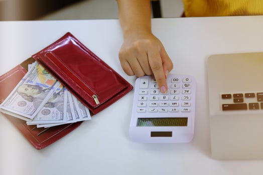 Woman Entrepreneur Calculating Cost Economic budget saving and investment concept. photo