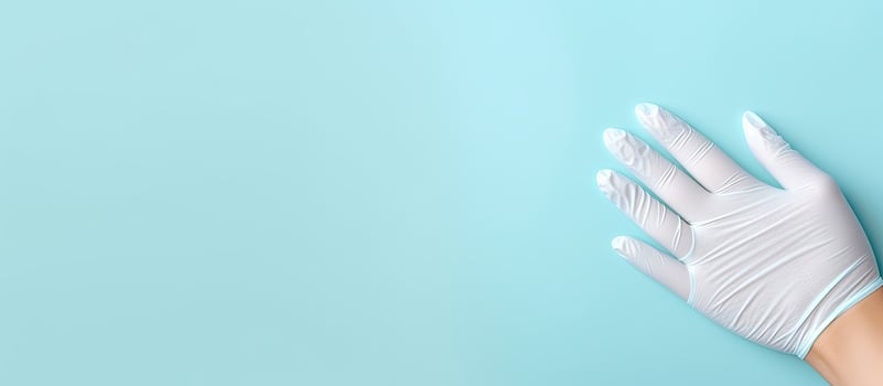 A pair of white gloves on a blue background created with technology photo