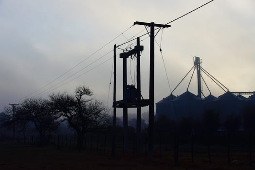 Electic line and storage steel silos, Buenos Aires Province, Patagonia, Argentina photo