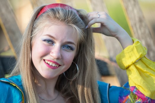 Beautiful country girl in 90s style with bright makeup and sports trowel. photo