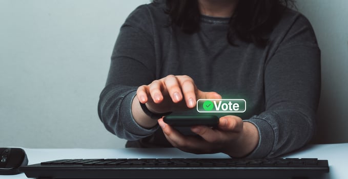 Woman use smartphone to vote online. Political concept. Electronic internet voting. Customer feedback. photo