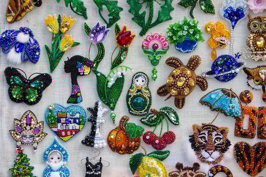 Beautiful diverse and colorful handmade brooches photo