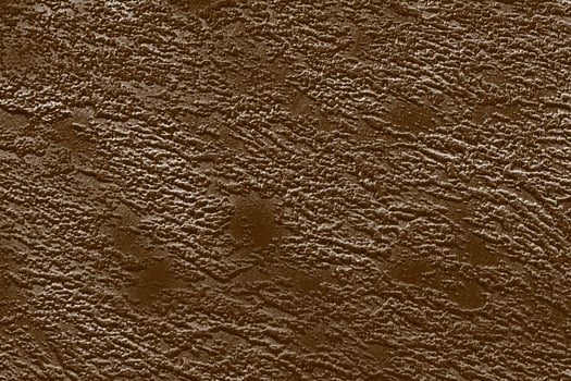 Dark brown textured paper background with light tints. photo