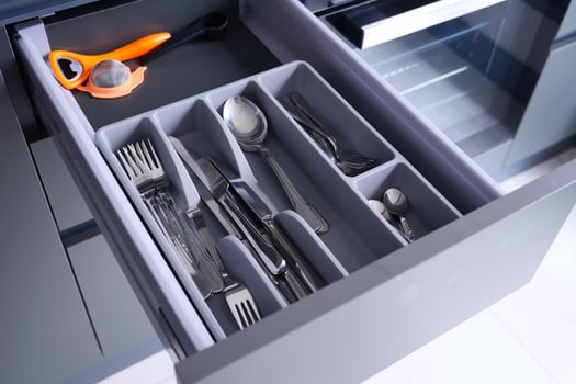 cutlery fork with knife and spoon in a drawer photo