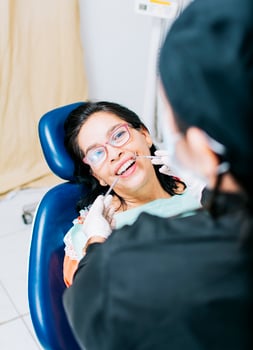 Patient checked by dentist, Top view of dentist doing dental checkup, close up of dentist with patient, dentist doing root canal treatment on patient photo
