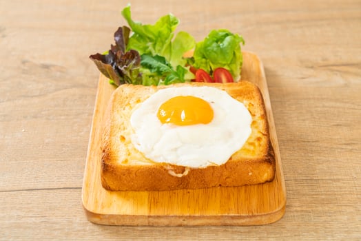bread toasted with cheese and fried egg photo
