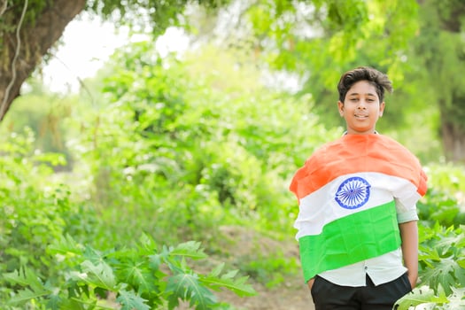 Indian boy holding national flag in farm, happy boy, national flag photo