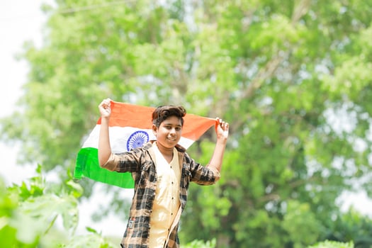 Indian boy holding national flag in farm, happy boy, national flag photo