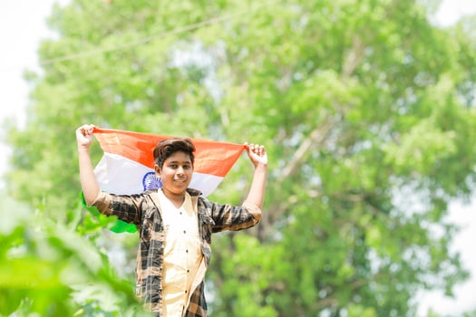 Indian boy holding national flag in farm, happy boy, national flag photo