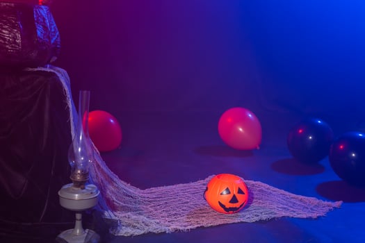 Symbol of Halloween. Jack-o-lantern on a dark background. Halloween card. Lamp in decorations. Background. photo
