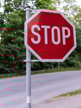 Stop Sign, landscape. Traffic stop sign on a pole next to the road. photo