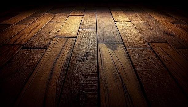 A wooden floor with a dark background and a light shining on it, photo