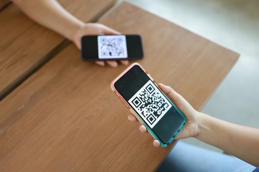 Qr code payment. Woman scanning QR code online shopping cashless technology concept. photo