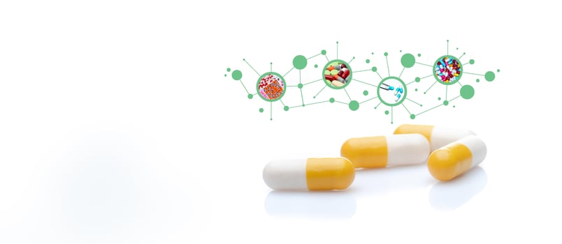 Yellow-white capsule pills with quality control in pharmaceutical industry concept. Pharmaceutical chemicals industry. Pharmacy products. Healthcare and medicine. Drug pharmacology and toxicology. photo