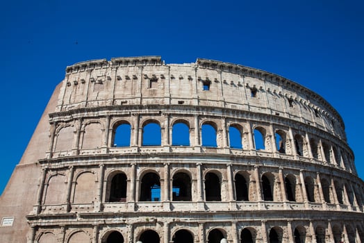 Detail of the famous Colosseum or Coliseum also known as the Flavian Amphitheatre in the centre of the city of Rome photo