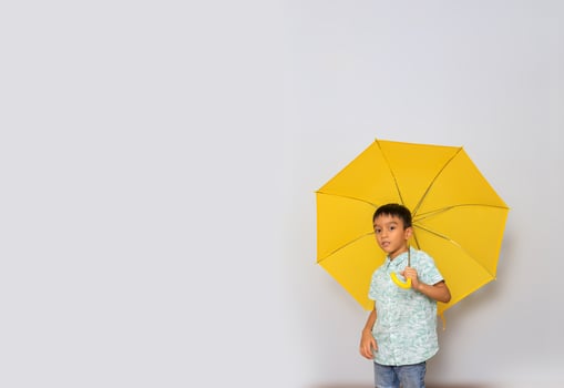 Cute little boy in casual outfit on background photo