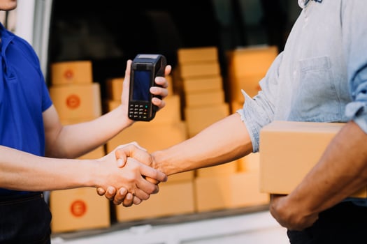 Young woman small business owner online shopping at home. taking note of orders from customers with mobile phones. SME entrepreneur or freelance life style concept. photo