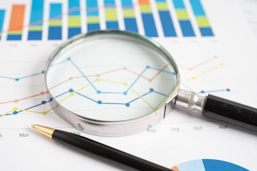 Magnifying glass on graph paper. Financial development, Banking Account, Statistics, Investment Analytic research data economy, Business concept. photo