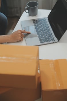 Starting small businesses SME owners female entrepreneurs Write the address on receipt box and check online orders to prepare to pack the boxes, sell to customers, sme business ideas online. photo