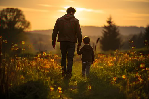 father and son are holding hands in the afternoon , photo