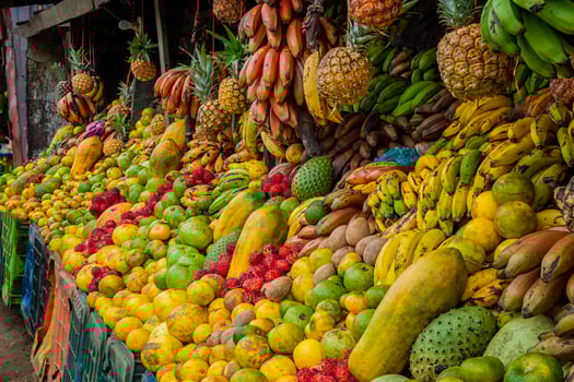 Shelf of many fresh fruits, fresh fruit stall, concept of fruits and healthy food, sale of various fruits photo