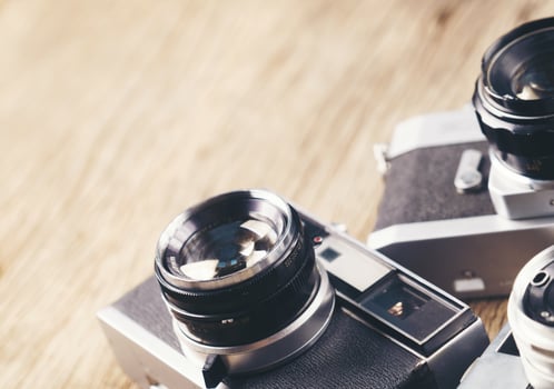 vintage old film camera on wood board photo
