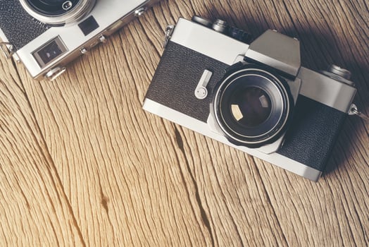 vintage old film camera on wood board photo