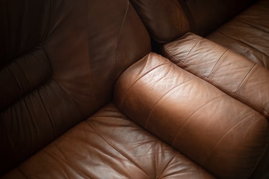 Leather sofa. Furniture details. Brown skin. Interior item. photo