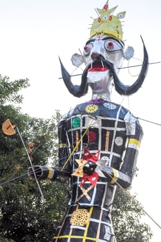 Ravnans being ignited during Dussera festival at ramleela ground in Delhi, India, Big statue of Ravana to get fire during the Fair of Dussera to celebrate the victory of truth by Lord Rama photo
