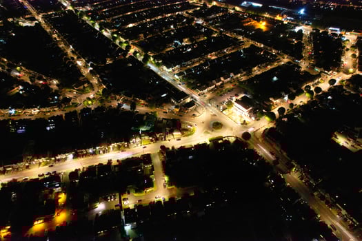 High Angle Footage of Central Luton City of England During Night. Illuminated City Centre Was Captured with Drone's Camera on July 8th 2023 During Mid Night photo